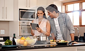 Couple, kitchen and cooking with online video on tablet, wellness and nutrition. Marriage, man and woman cut or read