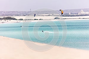 Couple of kite surfers and blue ocean