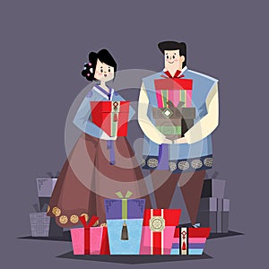 Couple in Korean traditional costume with holiday gifts