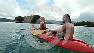 Couple, lake and talk with rowing kayak, sustainable transportation or point for travel in nature. Canoeing, boat and