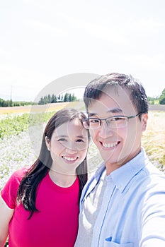 Couple with landscape in Furano