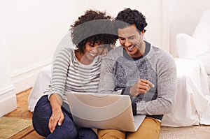 Couple, laptop and living room for internet, smile and love for home or house date. Man, woman and lounge for technology