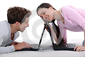 Couple with laptops