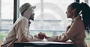 Couple, laughing and holding hands on table in restaurant backdrop, gen z and fashion aesthetic. Black people, man and