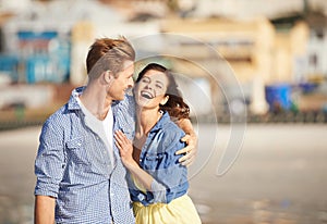 Couple, laughing and hug on funny romantic date or outing on sunny afternoon in South Africa. Big smile, man and woman