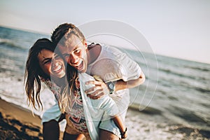 Couple laughing in love romance on travel honeymoon vacation summer holidays romance