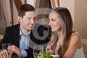 Couple laughing in a restaurant