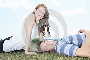 Couple lay grass