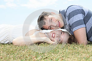Couple lay grass