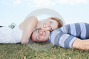 Couple lay grass