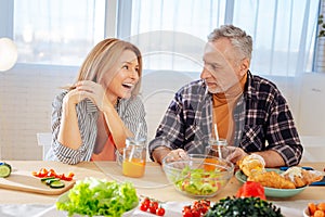 Couple leading healthy lifestyle eating salad and drinking juice