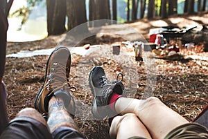 Couple Legs Relaxing Camping Outdoors Concept