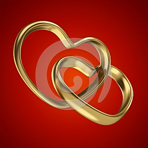 Couple of linked gold wedding rings on red background