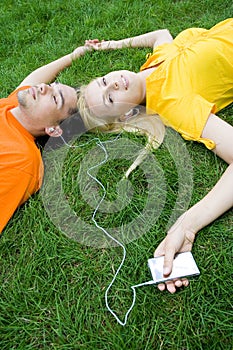 Couple listening to MP3 player