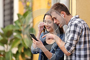 Couple listening to online music from smart phone