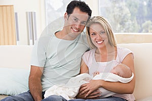 Couple in living room with baby