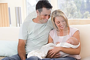 Couple in living room with baby