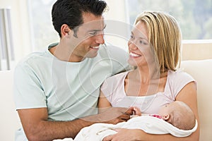 Couple in living room with baby