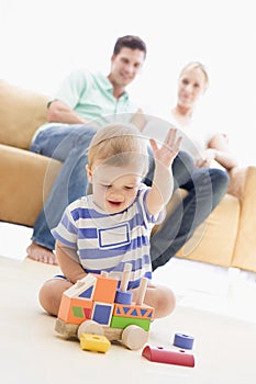 Couple in living room with baby