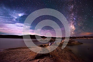 Couple looking at Beautiful Milky Way