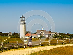 Couple Looking at a Cape Cod Lighthouse