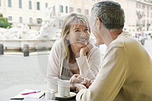 Couple Looking At Each Other At Outdoor Cafe