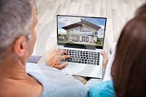Couple Looking At House