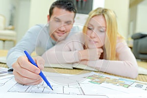 Couple looking at house plans