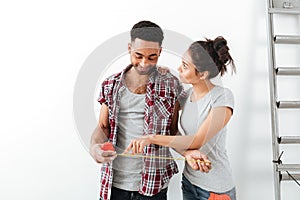 Couple looking at measure tape