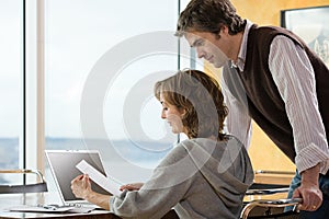 A couple looking at paperwork photo