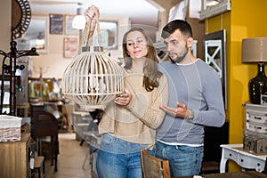 Couple looking for stylish hanging lamp