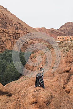 Couple in love on background of Todra gorge canyon landscape in Morocco