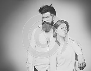 Couple in love. Barbershop concept. Fashion shot of couple after haircut. Woman on mysterious face with bearded man