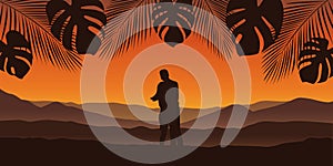 Couple in love at beautiful palm tree silhouette landscape in orange colors
