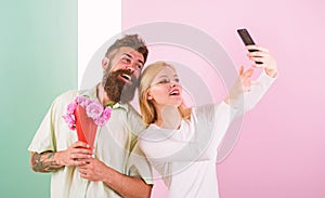 Couple in love bouquet dating celebrate anniversary relations. Sharing happy selfie. Taking selfie photo. Capturing