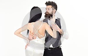 Couple in love, bride and groom in elegant clothes, white background. Hipster with lady dressed up for wedding ceremony