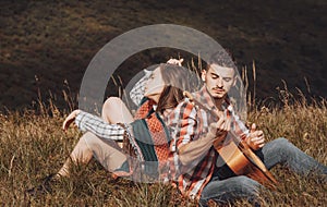 Couple in love on camp. Romantic music and happy couple relationships. Romance couple with guitar.