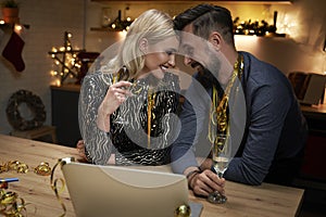 Couple in love celebrating New Year`s Eve at home