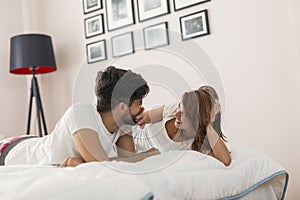 Couple in love cuddling in bed