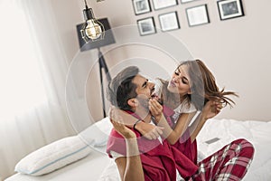 Couple having fun after waking up