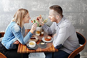 Couple in love on a date in a cafe.