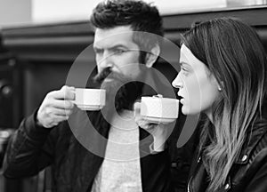 Couple in love drinks espresso during coffee break. Relationship and sweet life concept. Woman and man