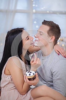 Couple in love eating sweet cake