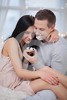 Couple in love eating sweet cake