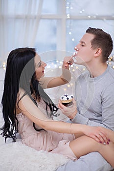 Couple in love eating sweet cake
