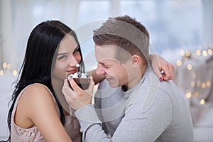 Couple in love eating sweet cake