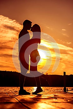 Couple Love Embrace, silhouette at sunrise