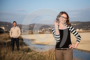 Couple in love on engagement day in natural park.