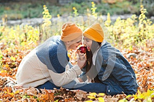 Couple in love enjoying autumn. Fashionable couple on a walk in nature. Love, relashionship and lifestyle
