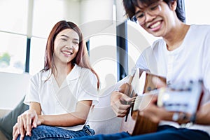 Couple in love, Happy couple of musicians with guitar. musical instruments and entertainment concept